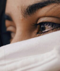 Young lady with tears in her eyes because of what ifs